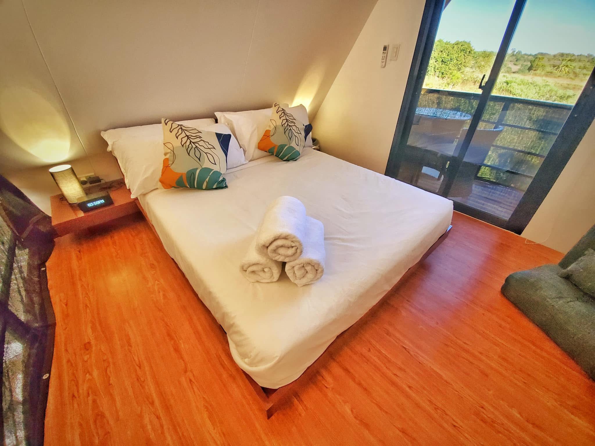 Bedroom with balcony view